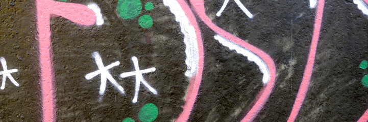 Colorful background of graffiti painting artwork with bright aerosol outlines on wall. Old school...