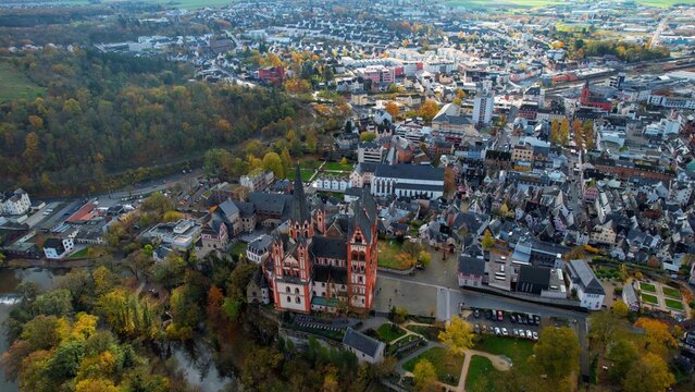 Aerial view of the old town around the city Limburg on an overcast day in fall in Germany.	