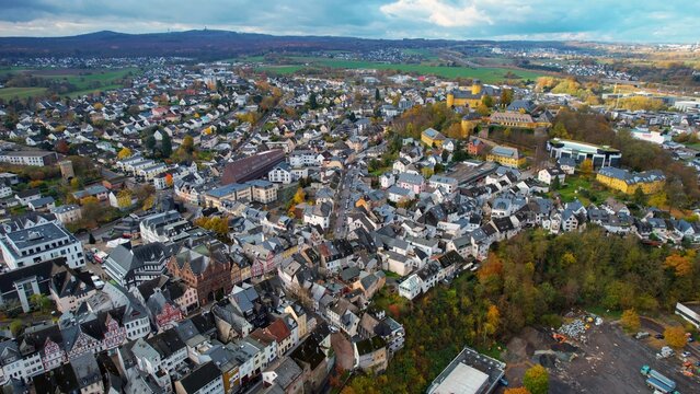 Aerial view of the old town around the city Montabaur on an overcast day in fall in Germany.	