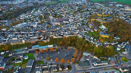 Aerial view of the old town around the city Montabaur on an overcast day in fall in Germany.	