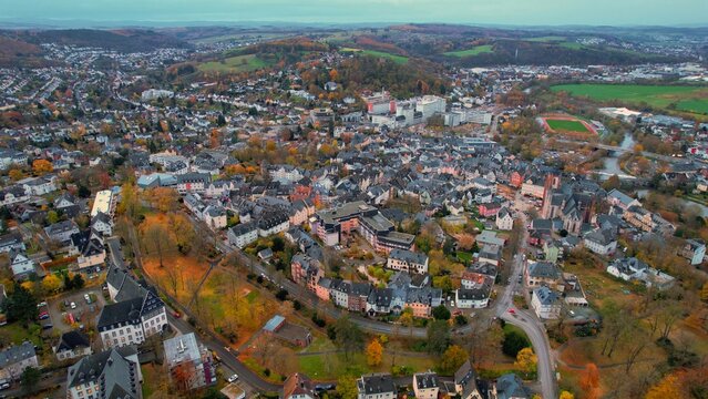 Aerial view of the old town around the city Wetzlar on an overcast day in fall in Germany.	