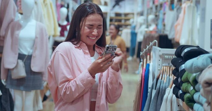 In mall's clothing store woman's joy visible as she texts in smartphone. Joy from blending fashion tech Joyful experience choosing attire embracing modernity Joy each purchase luxury lifestyle.