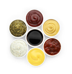 Many different sauces in bowls on white background, top view