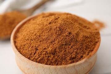 Aromatic spice. Ground red pepper in bowl on white table, closeup
