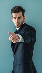Confident businessman black suit pointing directly at camera
