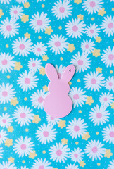 pink bunny tags on felt with abstract, stylized floral pattern