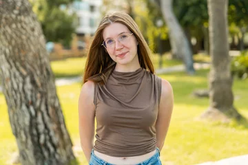 Foto op Plexiglas Young French girl with glasses at outdoors With happy expression © luismolinero