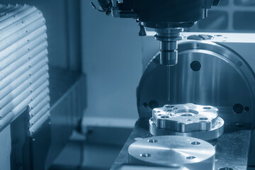 The 5-axis CNC milling machine  hole making the automotive part with drill tool. © Pixel_B