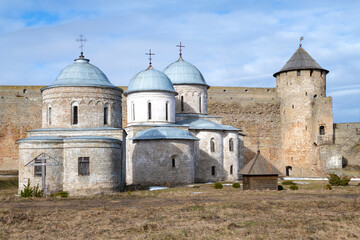 Ancient temples and the Gate Tower of the Ivangorod fortress on a sunny March day. Leningrad region, Russia - 759851201