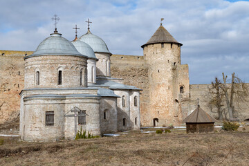 Ancient temples and the Gate Tower on a sunny March day. Ivangorod fortress. Leningrad region, Russia