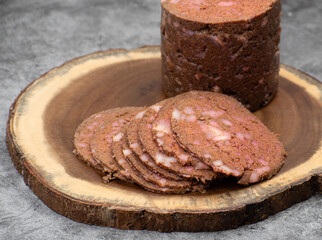 Vegan, plant based mock meat, sliced on wooden board