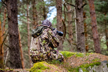view of wildlife photographer camouflage in nature