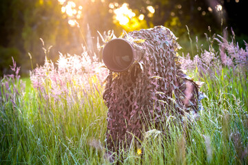 view of wildlife photographer camouflage in nature