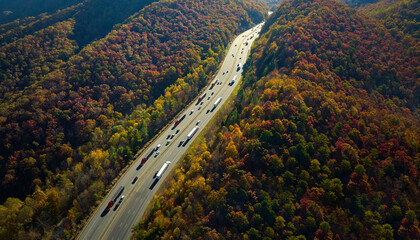 I-40 freeway in North Carolina leading to Asheville through Appalachian mountains in golden fall...