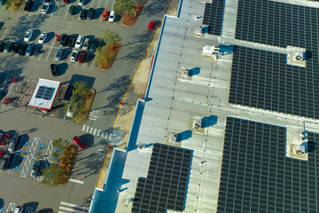 Production of sustainable energy. Solar power plant with blue photovoltaic panels mounted on...