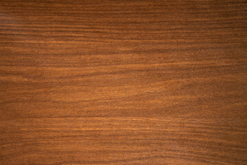 A photo of a clean wooden covering.The background is made of natural mahogany.Premium furniture...