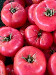 Healthy big pink tomatoes in Spanish market.