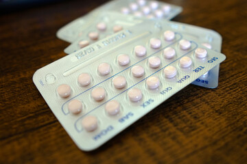 Fototapeta na wymiar Packs contraceptive pill. The first over-the-counter birth control pill will be available in US stores at the end of March, 2024.