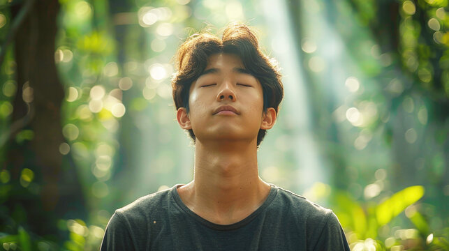 Man Enjoying the Moment Meditating Deep Breathing Stress Relief Concept of Beautiful Nature Wellness Wellbeing Good Thriving Life Green Tropical Rainforest Background 16:9