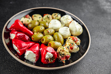 vegetable antipasti mix olives, mozzarella, stuffed pepper, mushroom  vegetarian food antipasto fresh food tasty appetizer meal food snack on the table copy space food background