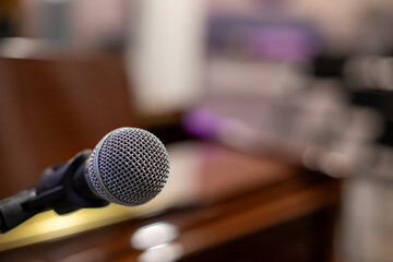 grey microphone in front of a piano