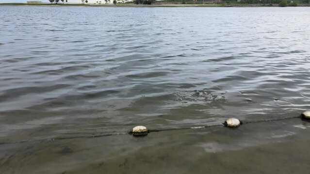 Beach in Jakarta, Indonesia, the water is not blue