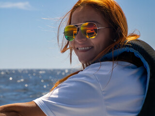 Beautiful red hair colombian latina girl on a boat in cabo san lucas mexico baja california sur pacific ocean cortez sea - 759900487