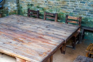 Wooden tables, chairs and benches in conference room in rural China