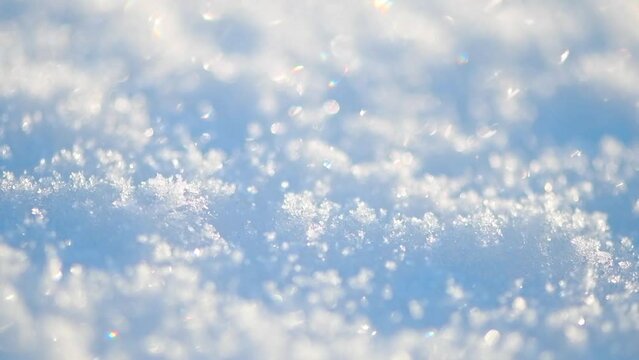 Natural snow background, snow glitters and shimmers like a rainbow in the sun, natural snow texture, slow motion