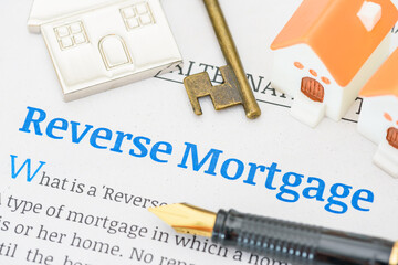 Fountain pen on a reverse mortgage document. A reverse mortgage is a loan for homeowners,...