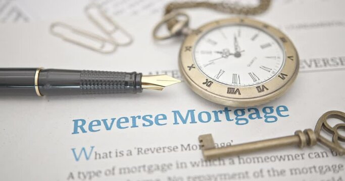 Fountain pen on a reverse mortgage document. A reverse mortgage is a loan for homeowners, converting home equity into cash. Repayment is typically deferred until the owner moves out or passes away.