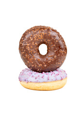 Two donuts with fruit and chocolate glaze on top of each other on a white background