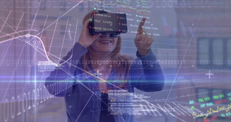 Image of stock market data processing over caucasian woman wearing vr headset at office