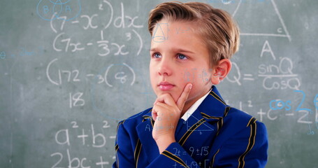 Image of math formulas over thoughtful caucasian boy over blackboard