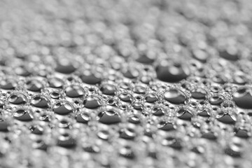 Abstract gray macro background with lots of soap bubbles.