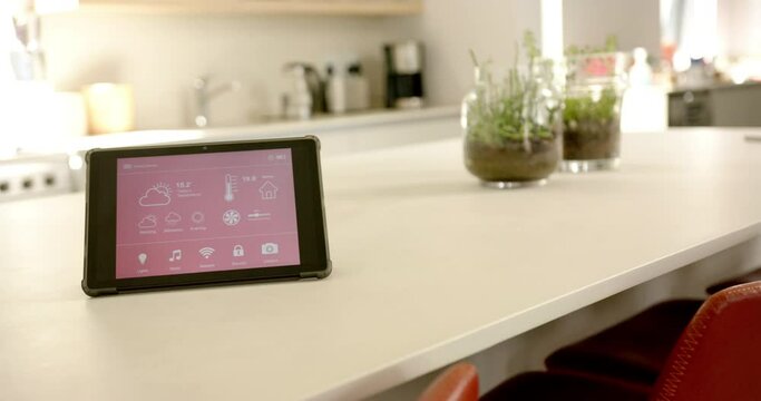 A smart home interface sits on a kitchen counter, copy space