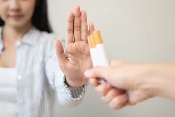 person showing hand sign to rejection cigarette for quit smoke motivation.