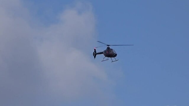 Helicopter flying towards the camera at regional airfield airport
