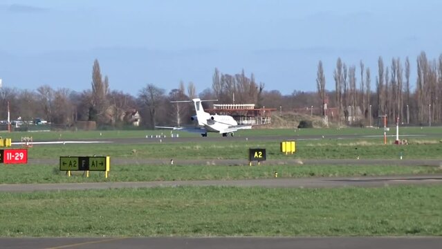 Business jet Landing with Touch Down at Airport (Corporate Executive Private Jet Touching down at Airfield)