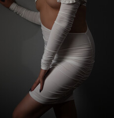 beautiful woman posing in white dress