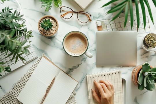 Overhead View Of A Workspace With Open Laptop, Coffee, Smartphone, And Notebook Amidst A Serene Setup With Lush Houseplants. Workspace Captured From Above Shows Laptop Amidst A Tranquil Setting ..