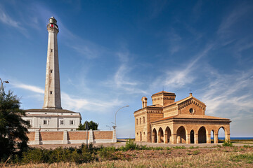 Punta Penna, Vasto, Abruzzo, Italy: view of the tall lighthouse and the Catholic church Santa Maria di Pennaluce on the coast of the Adriatic Sea - 759956604