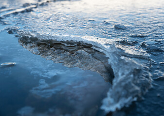 Ragged ice rising from the clear water