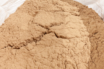 pile of sawdust in white bag