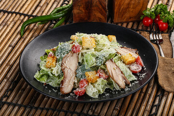 Caesar salad with chicken and romano