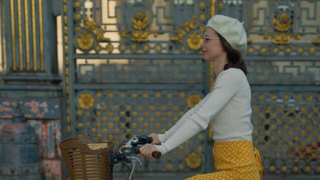 Close-Up of Cyclist Against Ornate Gate