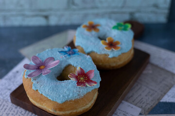 Overhead of  decorated and iced donuts