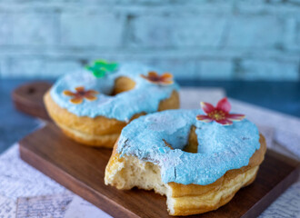 Overhead of  decorated and iced donuts