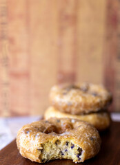 Close up of donut with a bite taken from one.