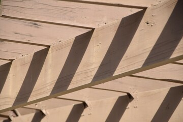 background of a support pergola beam rafters shadow